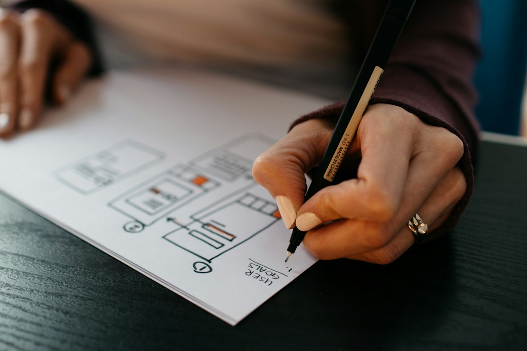 Designer reviewing website wireframe